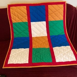 Beautiful hand made child’s quilt.